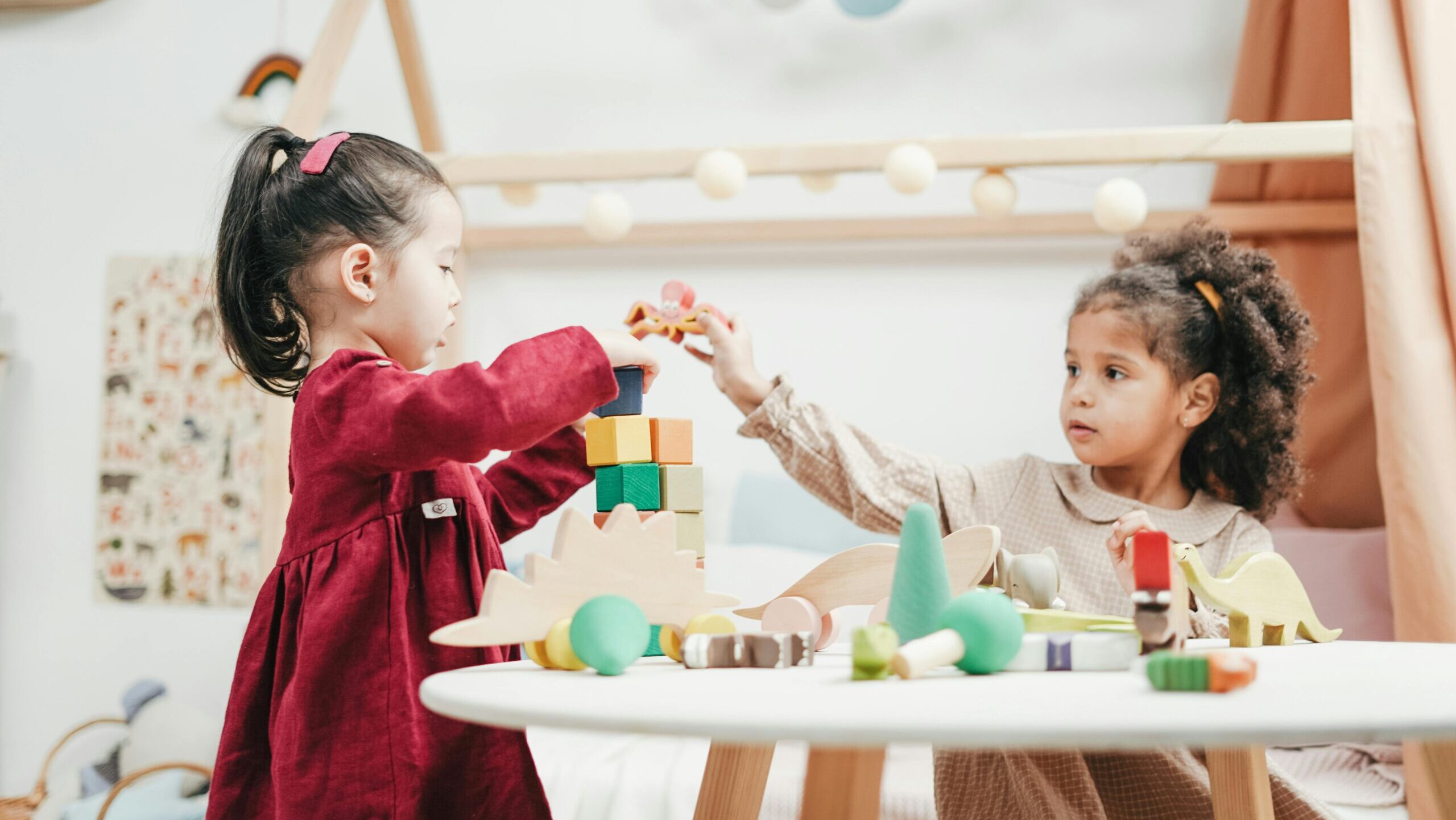 Girl In Red Dress Playing A wooden Blocks